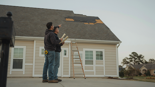 Homeowner inspecting roof before attempting DIY roof repair